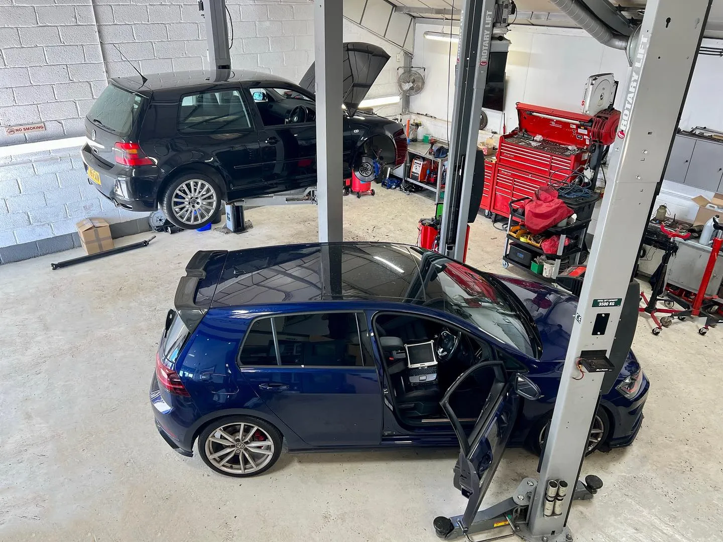 a car being worked on in a garage
